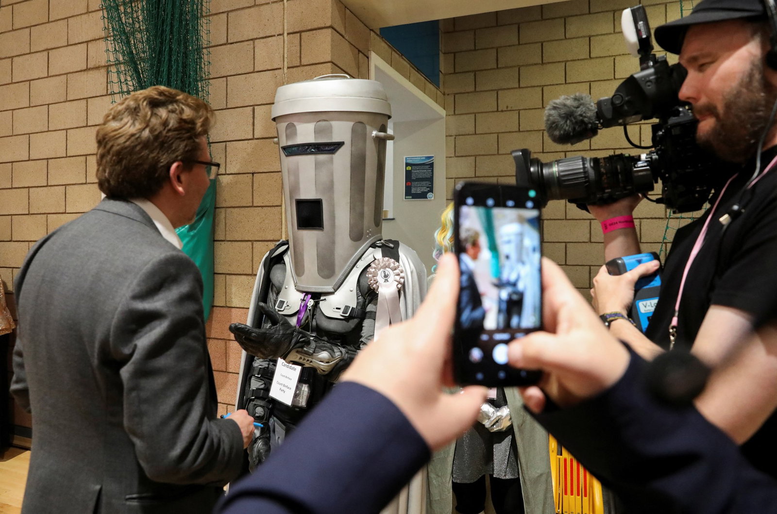 Man with bin over his head 